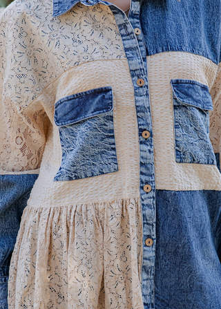 Mixed media denim shirt with lace patchwork, button-up front, long sleeves, and relaxed boho shirt-jacket fit.