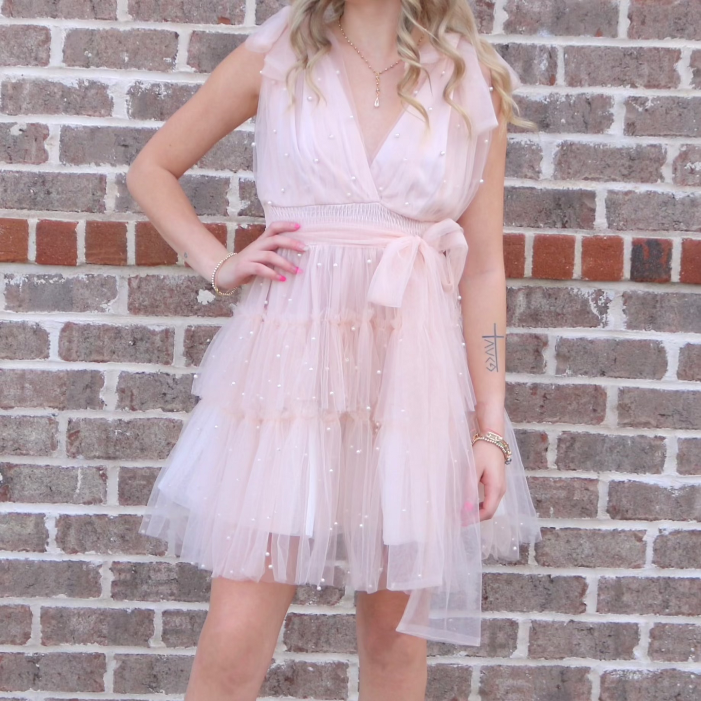 Baby Pink ruffle tulle tiered short dress with tie waist band wide tank sleeves, v neckline and peal detail 