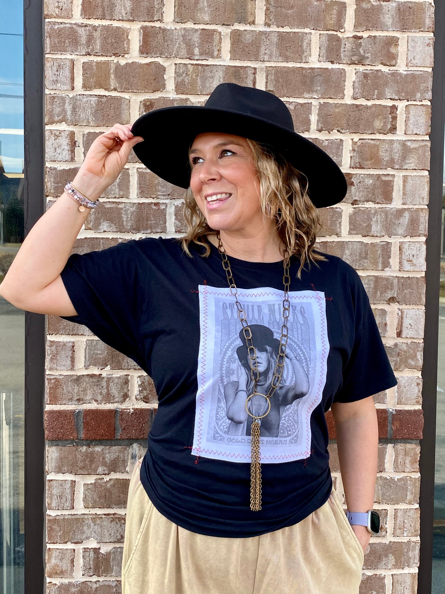 The Stevie Nicks Red Stitch Graphic Tee will have you fulfilling your Stevie Dreams. The Black and White portrait of Stevie is framed in an oversized red stitching. This oversize tee is soft and comfy, where tied with a jacket or flannel to complete your look!