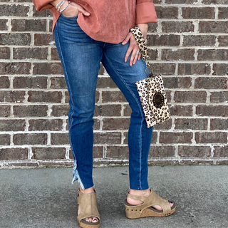 The Judy Blue High Waist Skinny Jean, features a side slit with frayed edges at the hem. The perfect dark wash skinny jean with the cute ankle detail and no other distressing. Adorable to wear with wedges or sandals. 