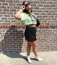 Whose ready for a night downtown Nashville! A breezy and blingy mini skirt (with built in shorts underneath), and it comes with a matching belt! This lined mini is a staple for any modern diva and pairs perfectly with  our Music City Button Up, one of our many band tees, or our matching Rhinestone Diva Fringe Tops! These can be accessorized with our Unite booties or even our Stargazer sneakers, which are the best Golden Goose dupes, ever! 