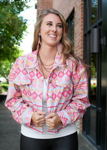 Cowgirl Barbie Jacket is the perfect jacket to throw on with spanx when going out. A corduroy lightweight feel, background is gray with bright pinks, reds and orange aztec design, don't forget the diamond fringe detail around the collar. Ready for a Nashville Night!