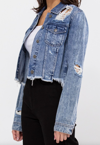 Everybody needs a basic light wash distressed cropped jacket. This jacket has button closures, light distressing all over and a distressed hemline. It is so easy to throw it on with about anything!!